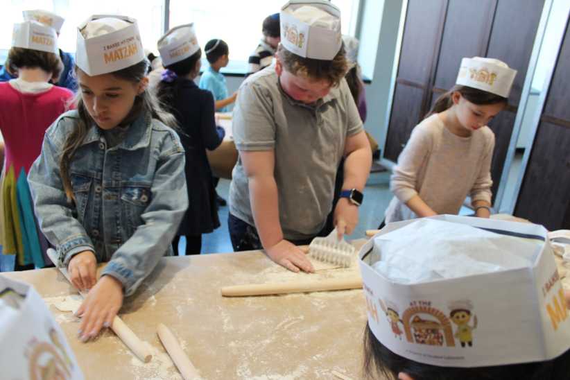 Children making matzah