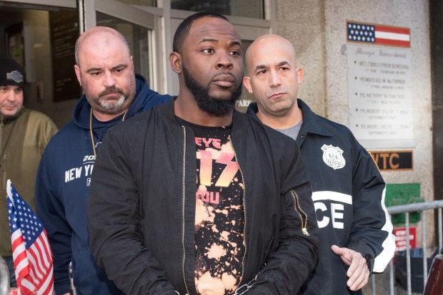 Suspect Daryl Campbell, center, also known as Taxstone, is taken from the 13th Precinct on Monday, Jan. 16, 2017, in New York. (Theodore Parisienne for New York Daily News)