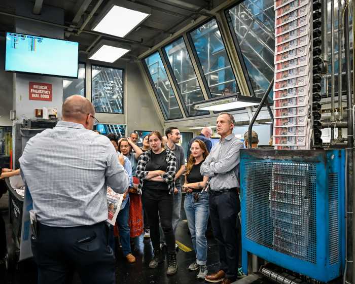 group of people in a printing plant