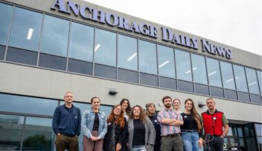 Anchorage News Guild Members standing outside of Anchorage Daily News