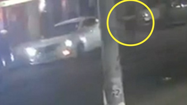 Jaikarran Seenarian (circled) is pictured moments before his electric stand-up scooter hit a pothole on Liberty Ave. near 109th St. in Richmond Hill. (Obtained by Daily News)