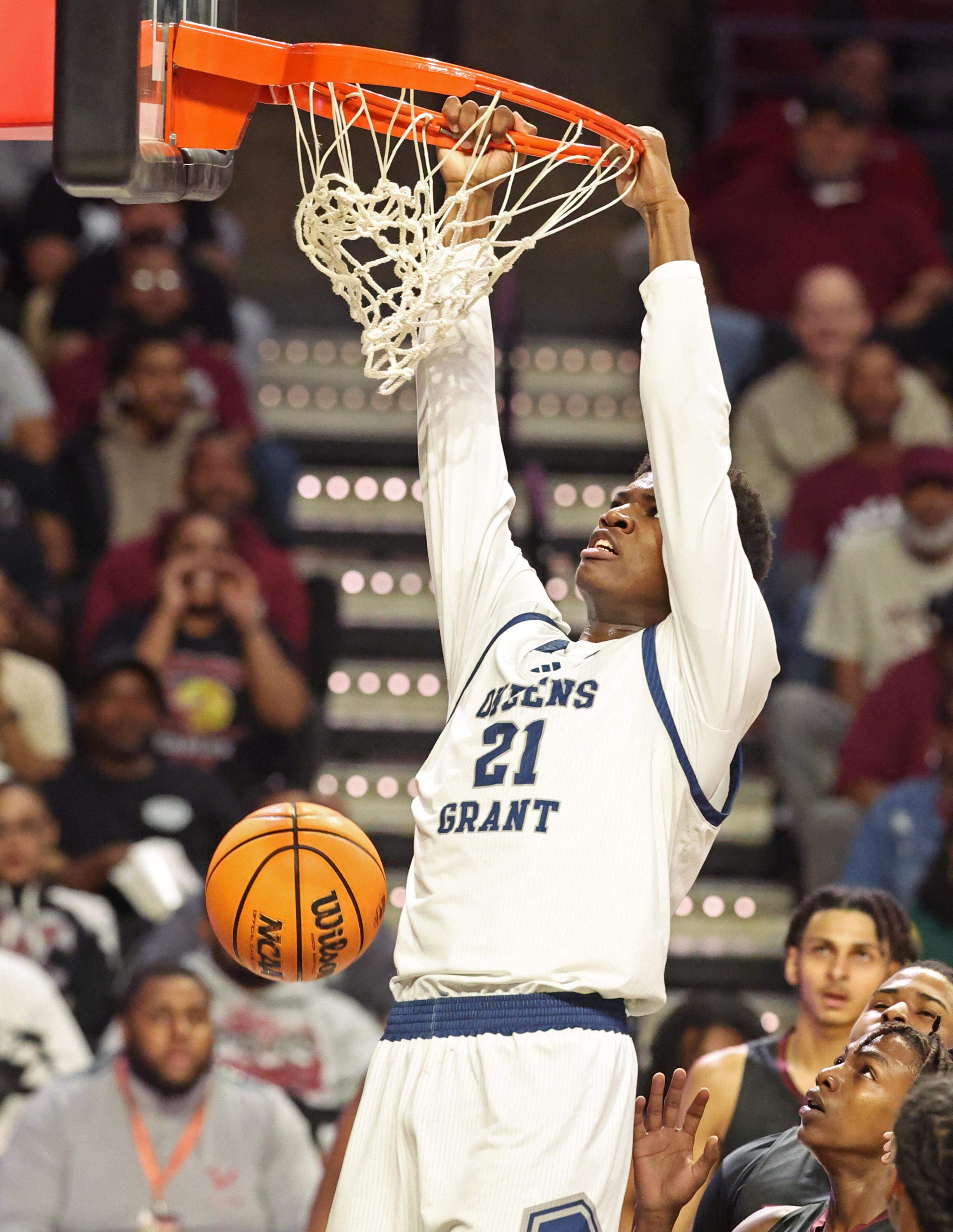 Queen’s Grant’s Chase Smith throws down a two-handed dunk during action against Warren County in the NCHSAA 2A boys’ championship game at Lawrence Joel Veterans Coliseum in Winston-Salem, NC on Thursday, March 12, 2026.