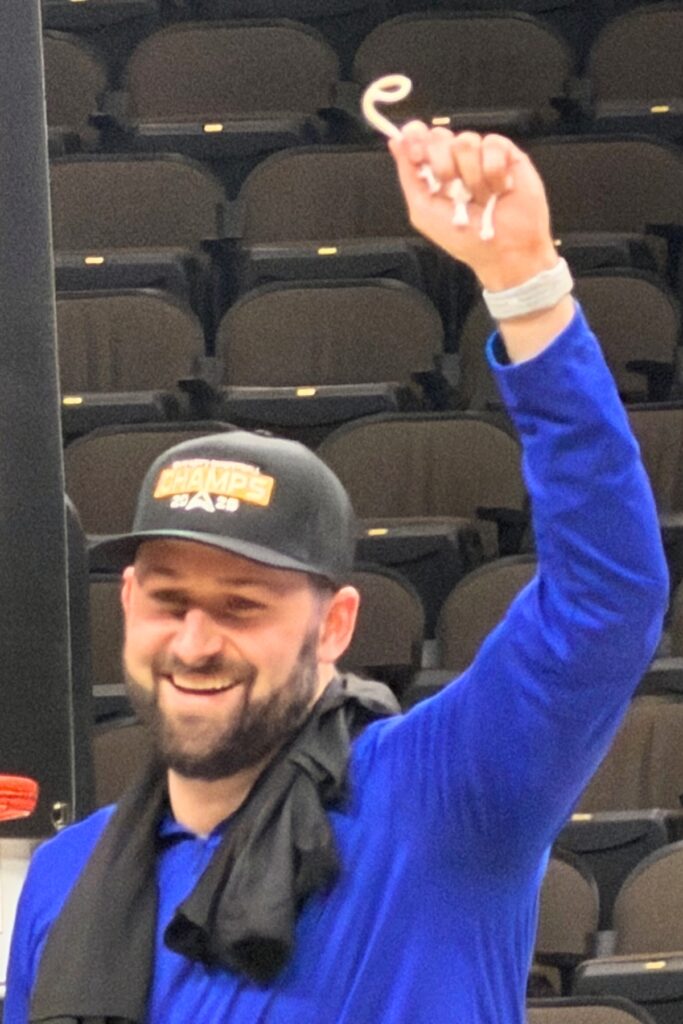 Queens University assistant coach and former Buchholz basketball player Bobby Horodyski cutting down the Atlantic Sun Conference Tournament nets on March 8. Courtesy of Bob Horodyski