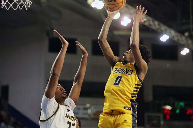 Lancaster's Jordan Watford shoots the ball against North Augusta's Jamison Mckenzie at the 2025 Class 4A state championships in Florence, S.C.