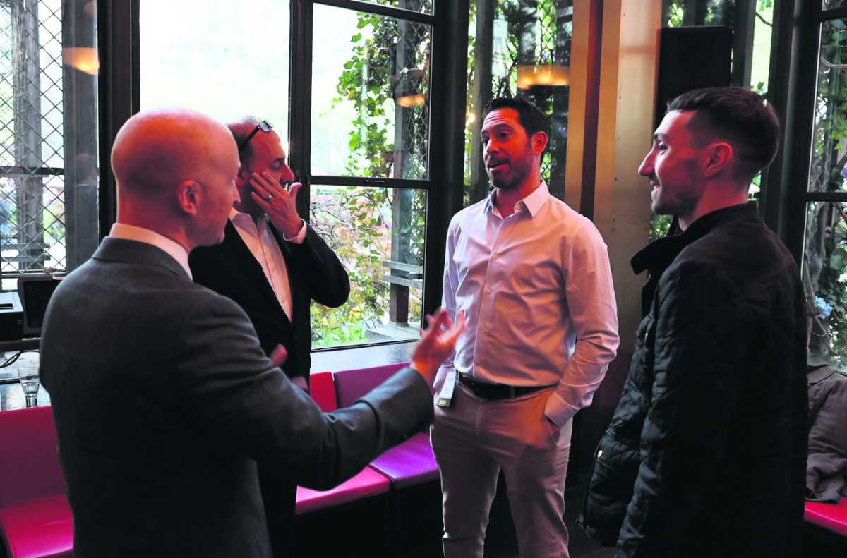 Rick McGuire (center)