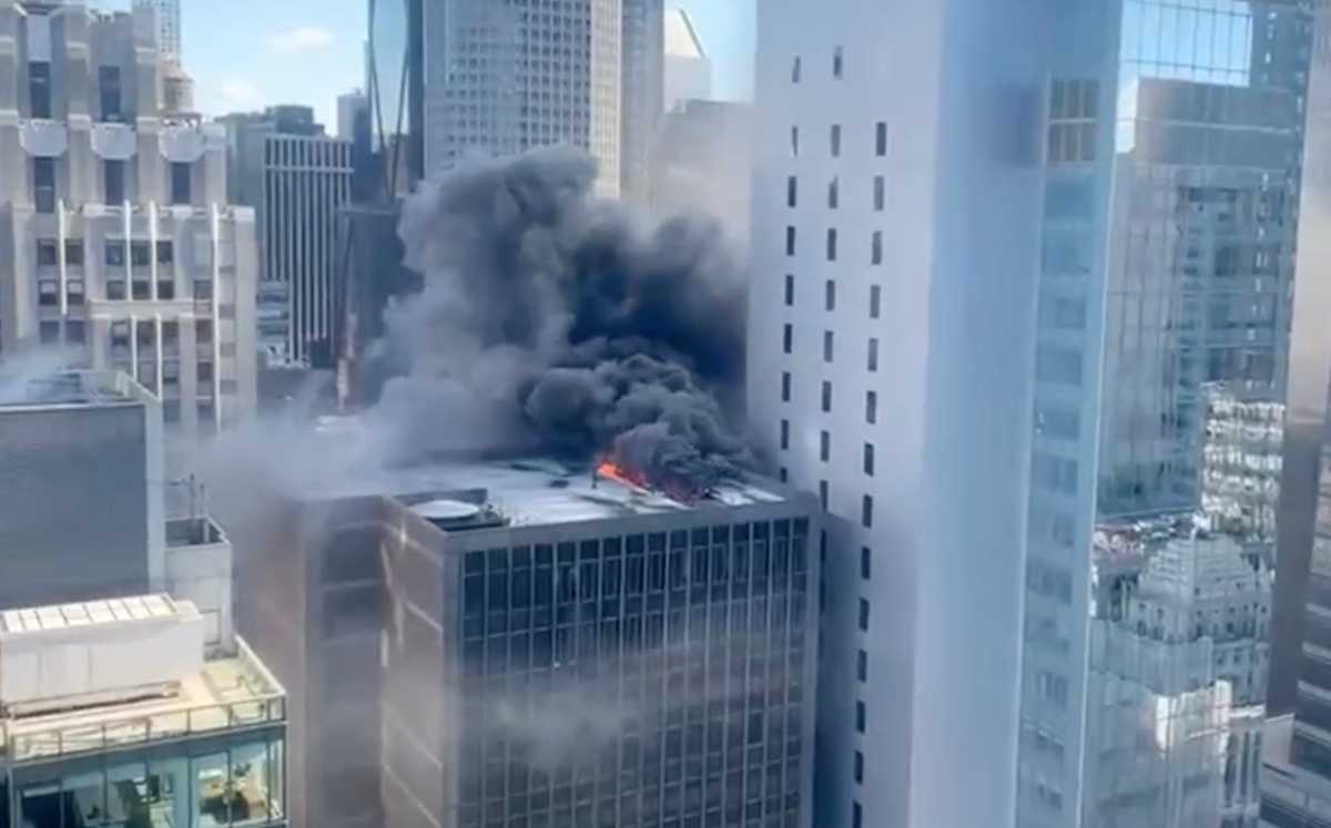heavy smoke and flames from Midtown building on fire