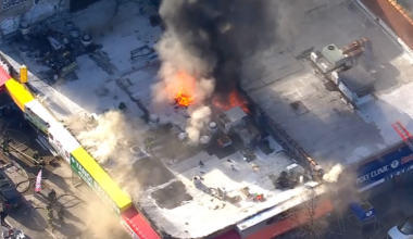 Fire tears through building housing row of businesses in Brooklyn