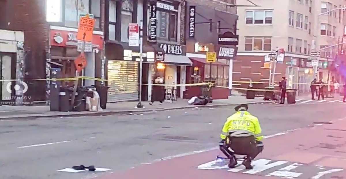 police officer squatting at scene of deadly Upper East Side hit-and-run