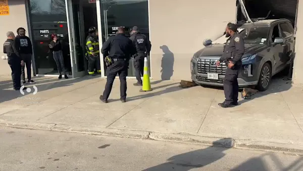 News 12 | Brooklyn | Car crashes into Midwood car dealership; 1 person injured