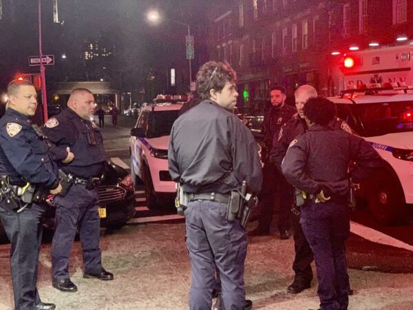 Police gather outside the Clark Street subway station following Friday night’s slashing attack. Photo: Mary Frost/Brooklyn Eagle
