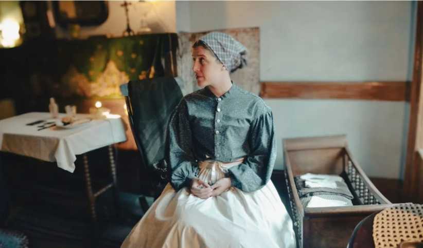 Woman dressed as Irish immigrant 