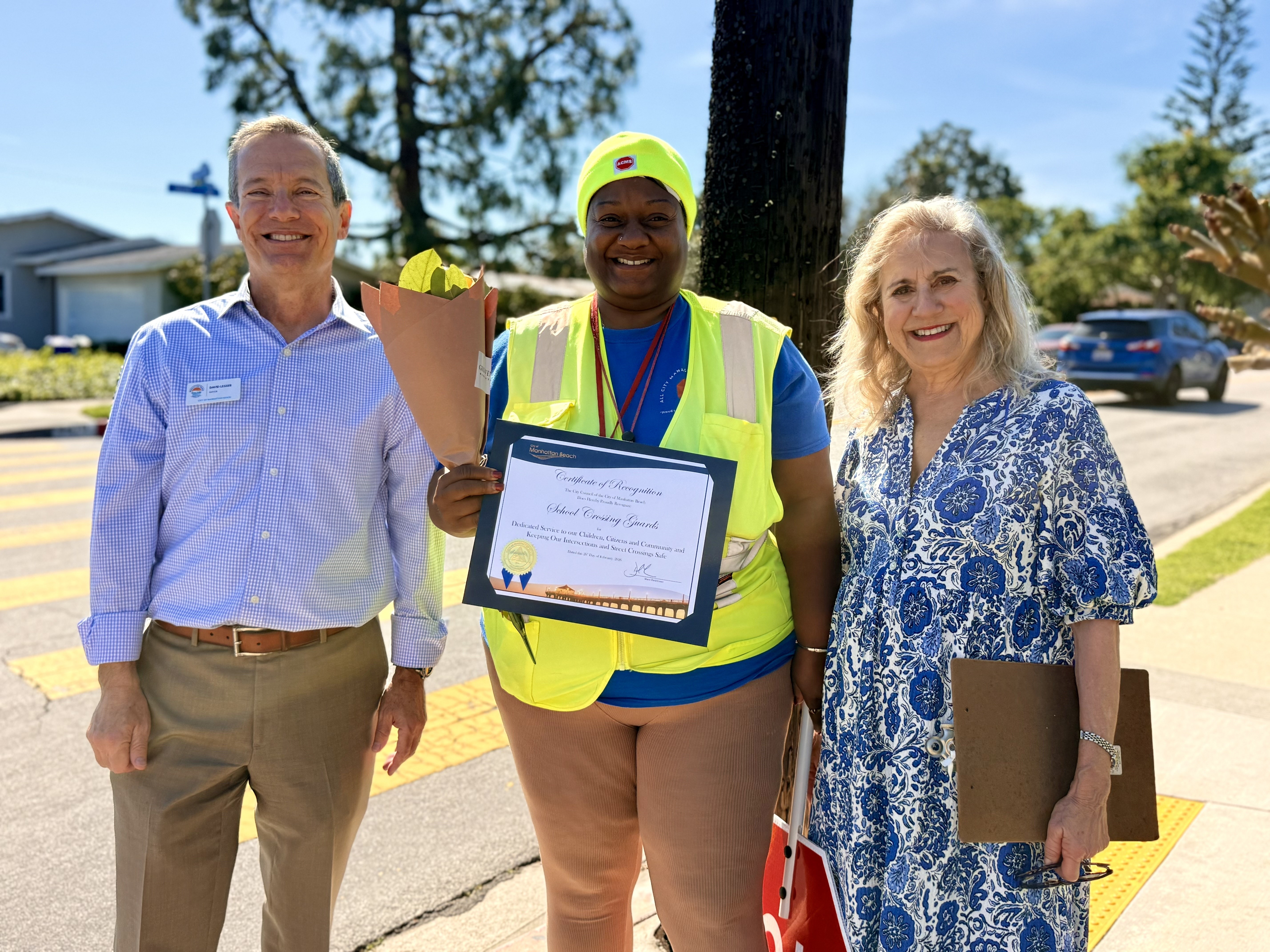 Manhattan Beach Mayor David Lesser, crossing guard Nicole Mitchell and...