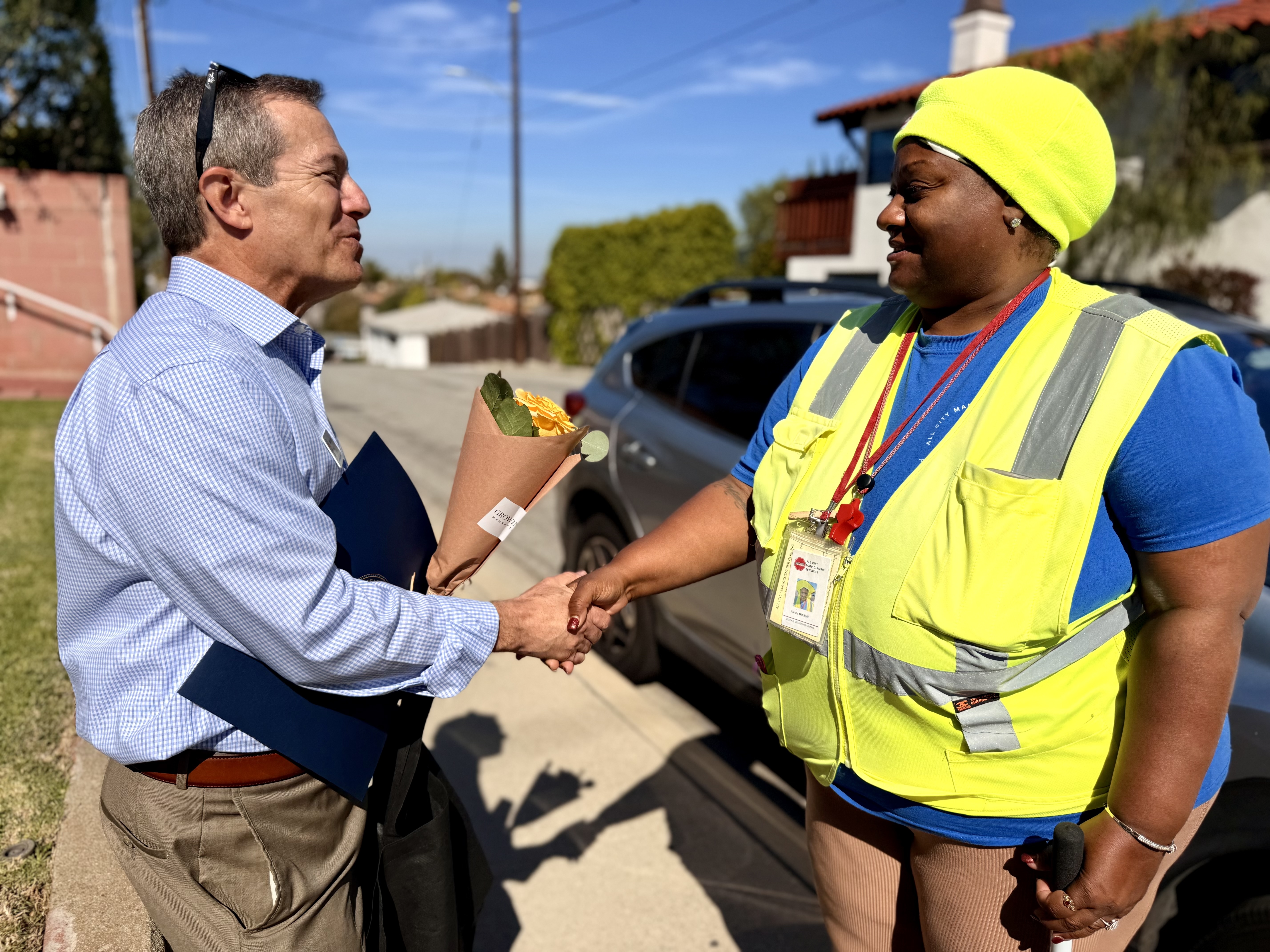 Manhattan Beach Mayor David Lesser surprised crossing guard Nicole Mitchell...