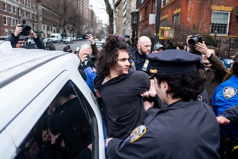 Police detain Emir Balat after police say he attempted to detonate an improvised explosive device during a counterprotest against an anti-Islam protest outside Gracie Mansion on Saturday in New York.