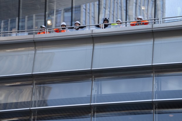 Workers watch bands perform in the Vessel during a "Battle of the Bands" in Hudson Yards Wednesday, March 11, 2026 in Manhattan, New York. The Battle of the Bands" features marching bands from teams competing in the 2026 BIG EAST Men's Basketball Tournament. (Barry Williams/ New York Daily News)