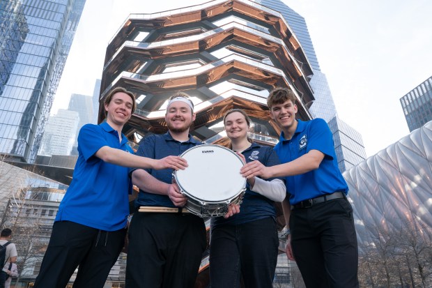 (L-R) Creighton University Pep Band drummers Eli Moe, far left, and Parker Crouch, far right, pose for a photo with Butler University Pep Band drummers Ethan Gutsche and Taylor Dietrich after the "Battle of the Bands" in the Vessel in Hudson Yards Wednesday, March 11, 2026 in Manhattan, New York. The Butler University drummers lent their counterparts at Creighton University their snare drum during show shuttling the drum between each band's performance. The Battle of the Bands" features marching bands from teams competing in the 2026 BIG EAST Men's Basketball Tournament. (Barry Williams/ New York Daily News)