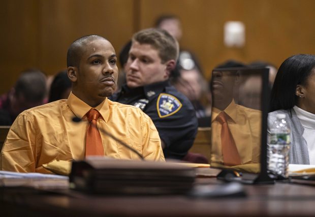 Guy Rivera, charged in the fatal shooting of NYPD Officer Jonathan Diller, listens to opening statements as his trial begins at Queens Criminal Court on Tuesday, March 10, 2026. (Dave Sanders/Pool/The New York Times)