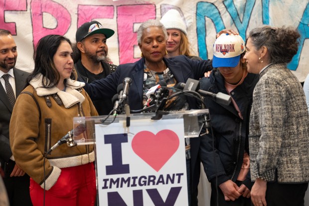 Jacqui Lewis, Senior Minister at Middle Church, prays over Dylan Lopez Contreras and his mother Raiza Contreras, during a press conference at Middle Church welcoming Dylan Lopez Contreras home from ICE detention Wednesday, March 19, 2026 in Brooklyn, New York. (Barry Williams/ New York Daily News)