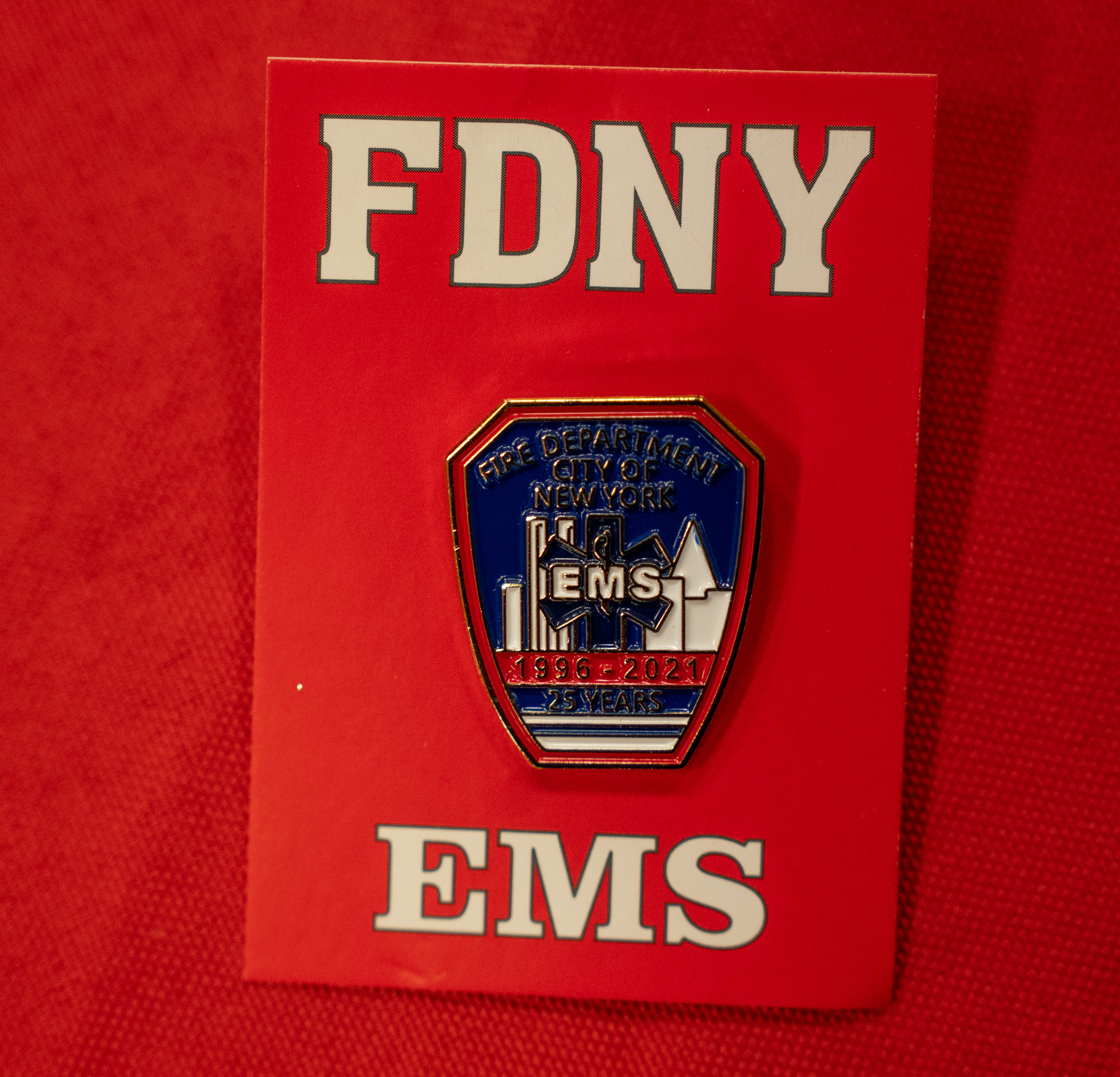 A comparative pin is pictured during a ceremony commemorating the 30th anniversary of the merger of NYC Health and Hospitals EMS with FDNY at the FDNY EMS Bureau of Training in Ft. Totten Park on Monday, March 16, 2026 in Queens, New York. (Barry Williams/ New York Daily News)