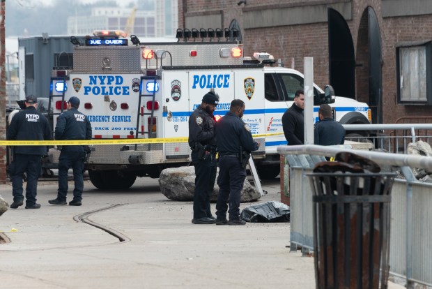 Police respond after a body was recovered from rocks on the shoreline in Red Hook, Brooklyn, on Saturday, March 7, 2026. (Gardiner Anderson / New York Daily News)