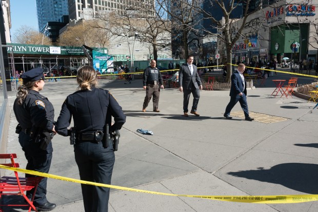 Police investigate after a woman was shot in the leg outside Fulton Mall in Brooklyn on Monday, March 9, 2026. A bloody pant leg from the victim is pictured at the scene. (Gardiner Anderson / New York Daily News)