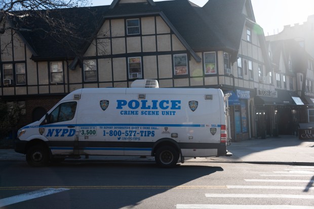 Police investigate a fatal shooting at 119-11 Metropolitan Ave. in Kew Gardens, Queens, on Tuesday, March 24, 2026. (Gardiner Anderson / New York Daily News)