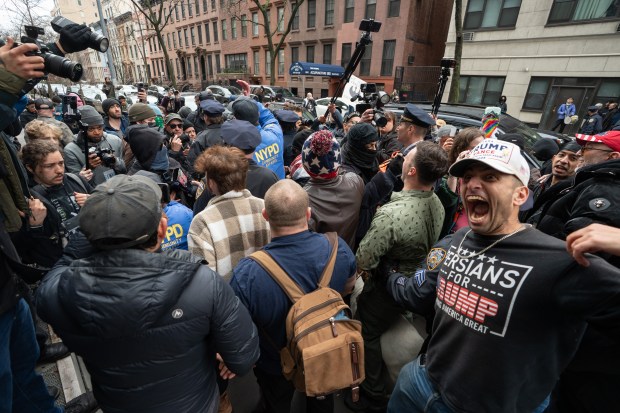 Jake Lang walks with a goat to a secured protest area near Gracie Mansion with NYPD protection Saturday, March 7, 2026, in Manhattan, New York. (Barry Williams/ New York Daily News)