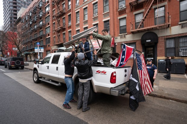 Jan. 6 rioter and far-right influencer Jake Lang (in truck flatbed at right) is pictured before a pig roast on the Upper East Side of Manhattan on Saturday, March 7, 2026. (Barry Williams / New York Daily News)