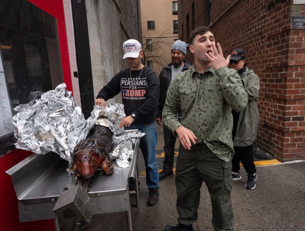 Jan. 6 rioter and far-right influencer Jake Lang (right) is pictured during a pig roast on the Upper East Side of Manhattan on Saturday, March 7, 2026. (Barry Williams / New York Daily News)