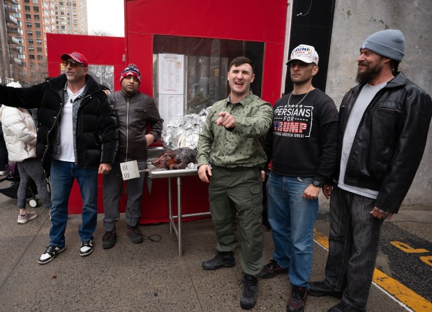 Jan. 6 rioter and far-right influencer Jake Lang (right) is pictured during a pig roast on the Upper East Side of Manhattan on Saturday, March 7, 2026. (Barry Williams / New York Daily News)
