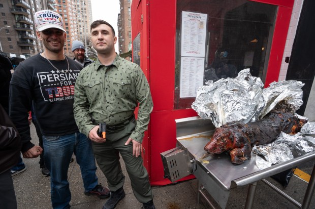 Jan. 6 rioter and far-right influencer Jake Lang (center) is pictured during a pig roast on the Upper East Side of Manhattan on Saturday, March 7, 2026. (Barry Williams / New York Daily News)