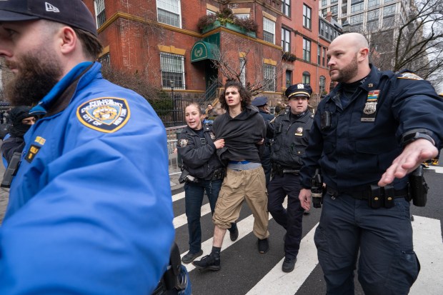 A man is arrested after throwing a hand-made smoke device at right-wing activist Jake Lang and his supporters on Saturday, March 7, 2026, in Manhattan, New York. (Barry Williams/ New York Daily News)