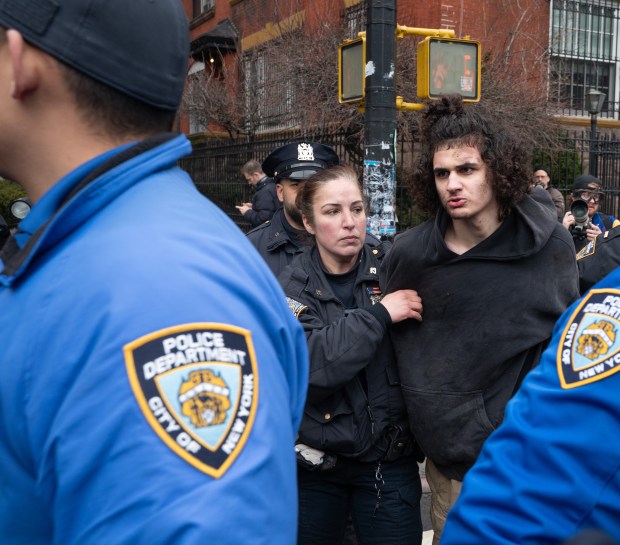 A man is arrested after throwing a hand-made smoke device at right-wing activist Jake Lang and his supporters on Saturday, March 7, 2026, in Manhattan, New York. (Barry Williams/ New York Daily News)