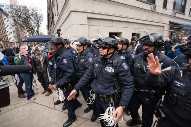NYPD SRG officers clear counter-demonstrators from the area near Gracie Mansion so Jake Lang and his fellow protestors could leave Saturday, March 7, 2026 in Manhattan, New York. (Barry Williams/ New York Daily News)