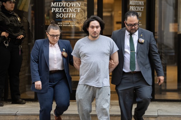 Michael Santiago is pictured in police custody leaving the NYPD's Midtown South Precinct stationhouse on Thursday, Feb. 26, 2026, in Manhattan, New York. (Barry Williams/ New York Daily News)