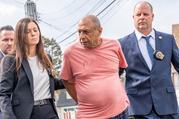 Rupchand Simboo, the suspect in the murder and dismemberment of his wife, Salisha Ali, is pictured in police custody leaving the NYPD's 116th Precinct stationhouse in Queens on Wednesday, March 11, 2026. (Theodore Parisienne / New York Daily News)