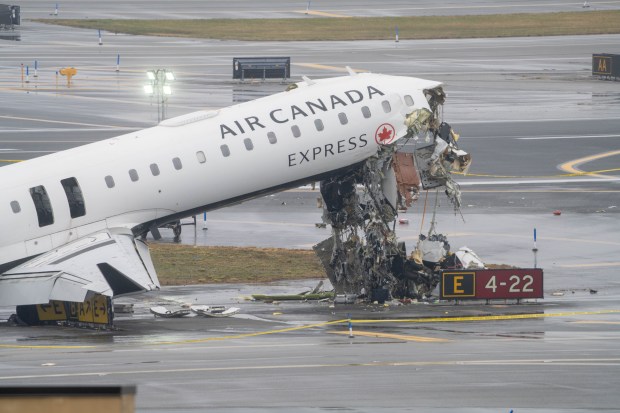 An Air Canada Express plane is pictured after it smashed into a PAPD emergency vehicle on a runway at LaGuardia Airport in Queens on Monday, March 23, 2026. (Theodore Parisienne / New York Daily News)