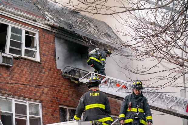 Three people were killed, including a child of unknown age, with several others suffering serious injuries, after a four-alarm fire broke out inside a two story residence at 44-49 College Point Boulevard in Queens on Monday March 16, 2026. 1309. (Theodore Parisienne / New York Daily News)