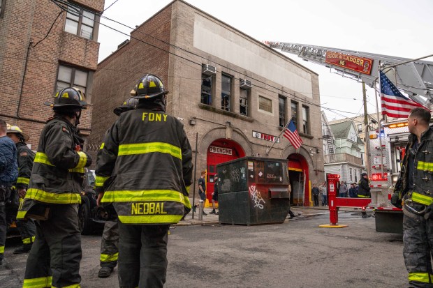 Firefighters work the scene after a two-alarm fire inside an FDNY firehouse, home to Battalion 27, Engine 79 and Ladder 37, in the Bronx on Friday, March 27, 2026. (Theodore Parisienne / New York Daily News)