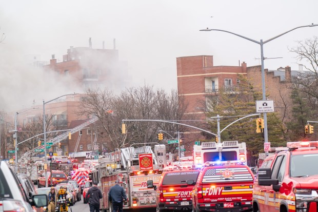 Three people were killed, including a child of unknown age, with several others suffering serious injuries, after a four-alarm fire broke out inside a two story residence at 44-49 College Point Boulevard in Queens on Monday March 16, 2026. 1309. (Theodore Parisienne / New York Daily News)