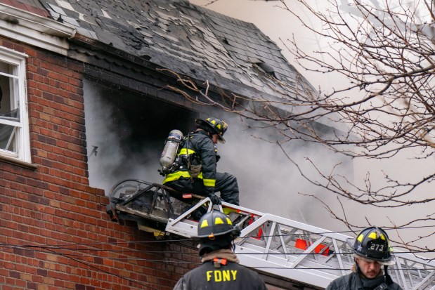 Three people were killed, including a child of unknown age, with several others suffering serious injuries, after a four-alarm fire broke out inside a two story residence at 44-49 College Point Boulevard in Queens on Monday March 16, 2026. 1309. (Theodore Parisienne / New York Daily News)
