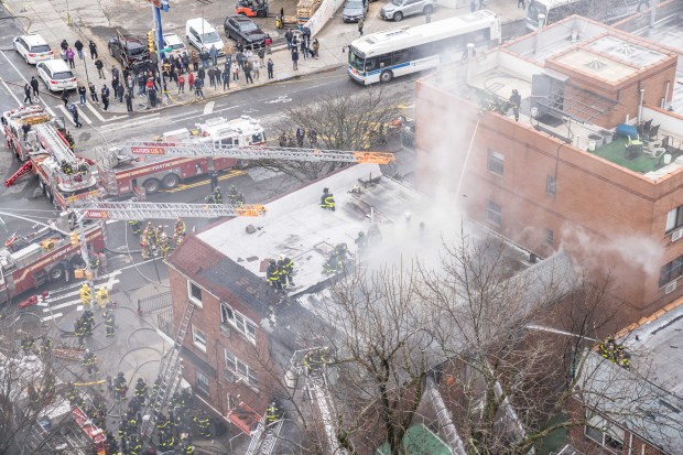 Three people were killed, including a child of unknown age, with several others suffering serious injuries, after a four-alarm fire broke out inside a two story residence at 44-49 College Point Boulevard in Queens on Monday March 16, 2026. 1309. (Theodore Parisienne / New York Daily News)