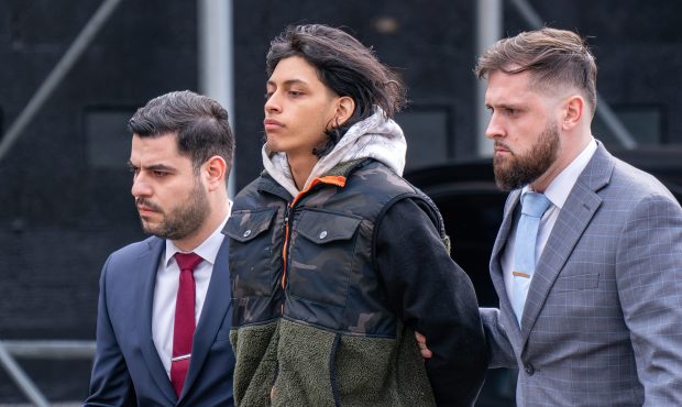Luis Emmanuel Valencia Ponce in police custody leaving the NYPD's 115th Precinct stationhouse in Queens on Thursday, March 19, 2026.
