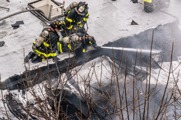 Three people were killed, including a child of unknown age, with several others suffering serious injuries, after a four-alarm fire broke out inside a two story residence at 44-49 College Point Boulevard in Queens on Monday March 16, 2026. 1309. (Theodore Parisienne / New York Daily News)