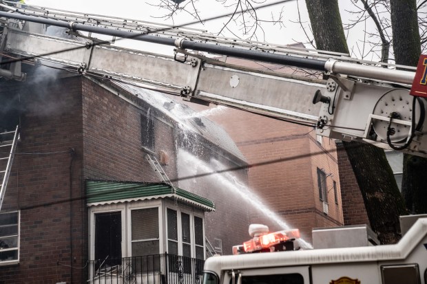 Three people were killed, including a child of unknown age, with several others suffering serious injuries, after a four-alarm fire broke out inside a two story residence at 44-49 College Point Boulevard in Queens on Monday March 16, 2026. 1309. (Theodore Parisienne / New York Daily News)
