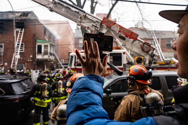 Three people were killed, including a child of unknown age, with several others suffering serious injuries, after a four-alarm fire broke out inside a two story residence at 44-49 College Point Boulevard in Queens on Monday March 16, 2026. 1309. (Theodore Parisienne / New York Daily News)