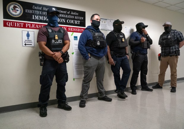 Federal law enforcement officers are pictured outside an immigration courtrooms at the Jacob K. Javits Federal Building on Friday, Nov. 21, 2025 in Manhattan, New York. (Barry Williams/ New York Daily News)