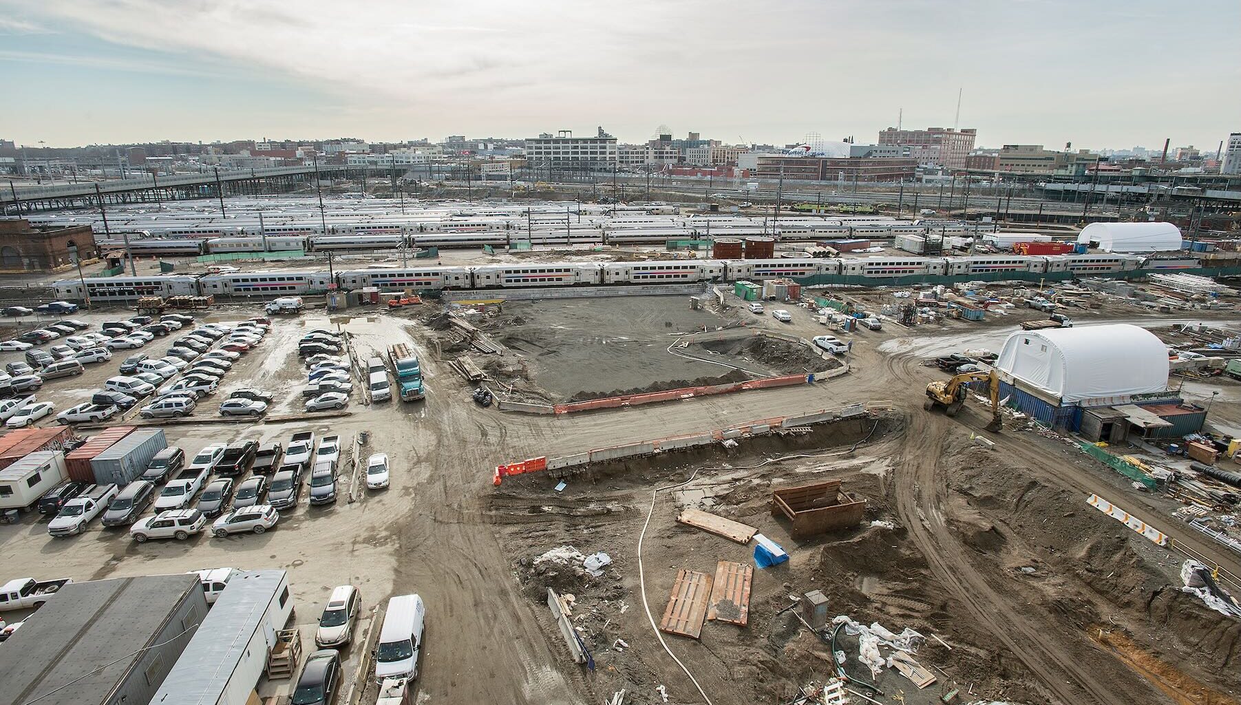 Aerial view of construction next to railroad yard