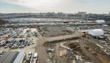 Aerial view of construction next to railroad yard