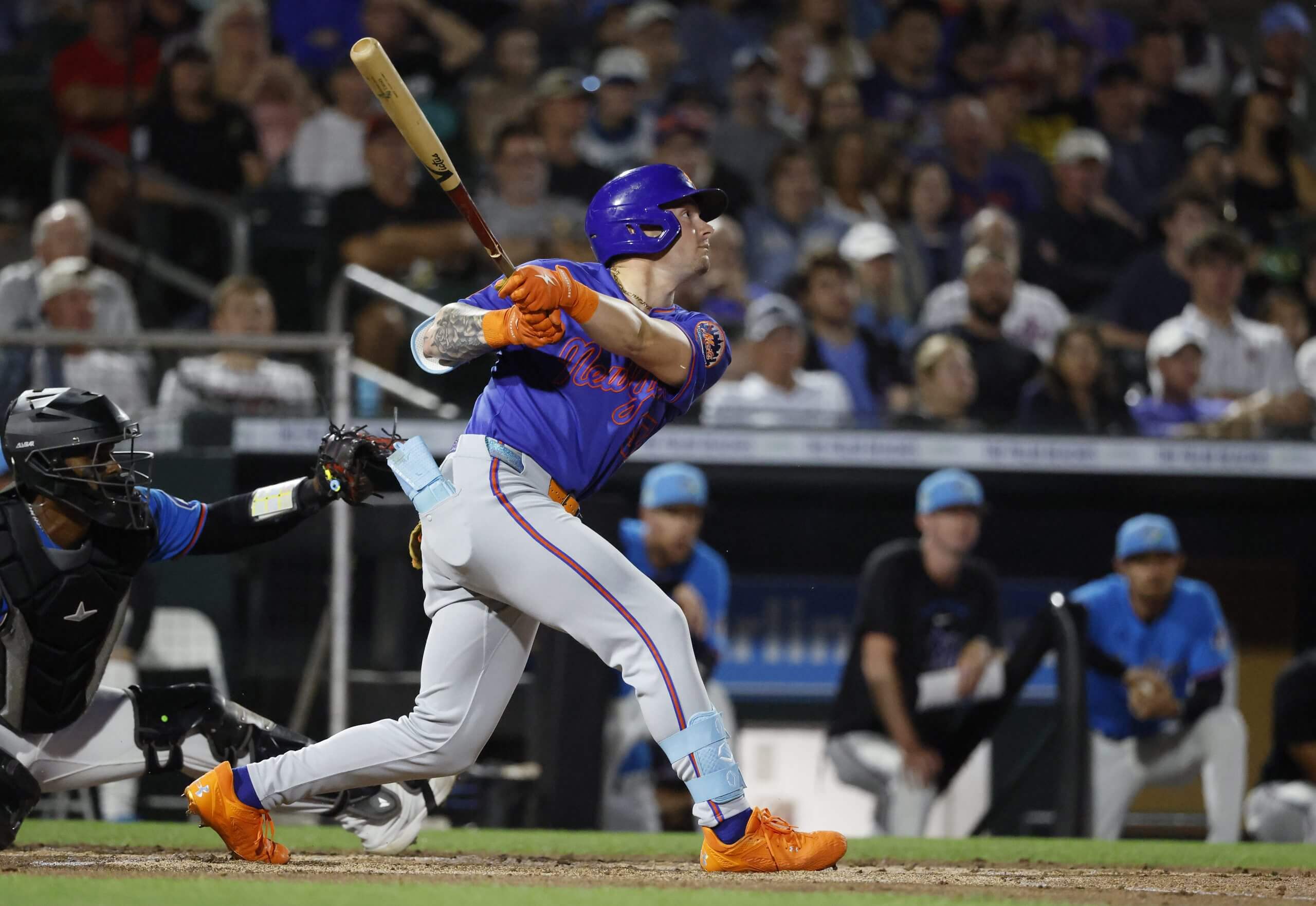 A.J. Ewing of the Mets takes a big left-handed swing at the plate.